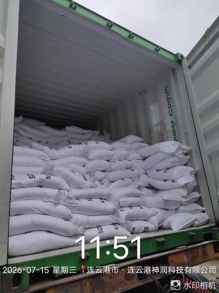 25 kg bags of fused silica sand and powder loaded into a shipping container for export